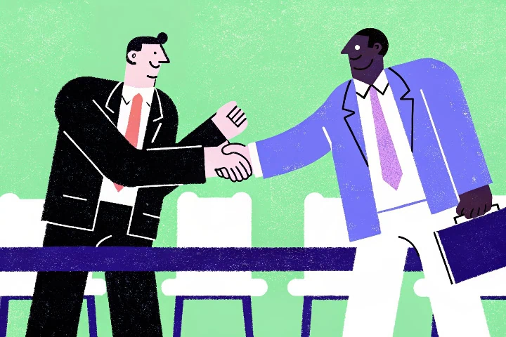 Dois homens apertam mãos para simbolizar ética nos negócios.